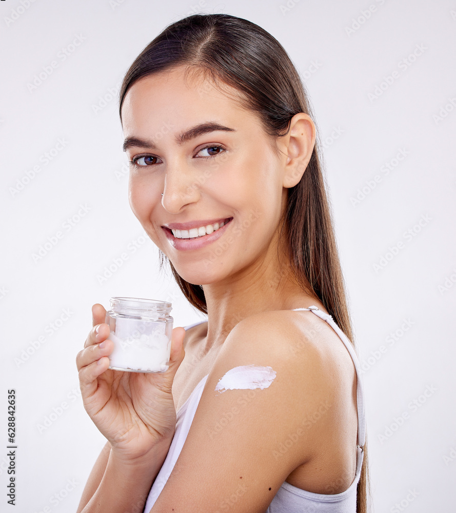 Body, skincare and woman with cream jar isolated on a white background in studio. Portrait, happy and model with sunscreen on shoulder, natural cosmetics or lotion for beauty, dermatology and health Body, skincare and woman with cream jar isolated on a white background in studio. Portrait, happy and model with sunscreen on shoulder, natural cosmetics or lotion for beauty, dermatology and health