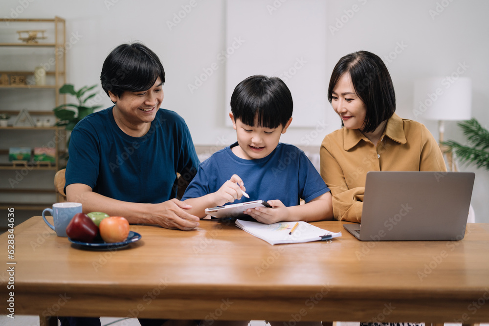 work from home education concept and family at home sitting at desk business woman working on internet in laptop child writing in notebook work from home education concept and family at home sitting at desk business woman working on internet in laptop child writing in notebook