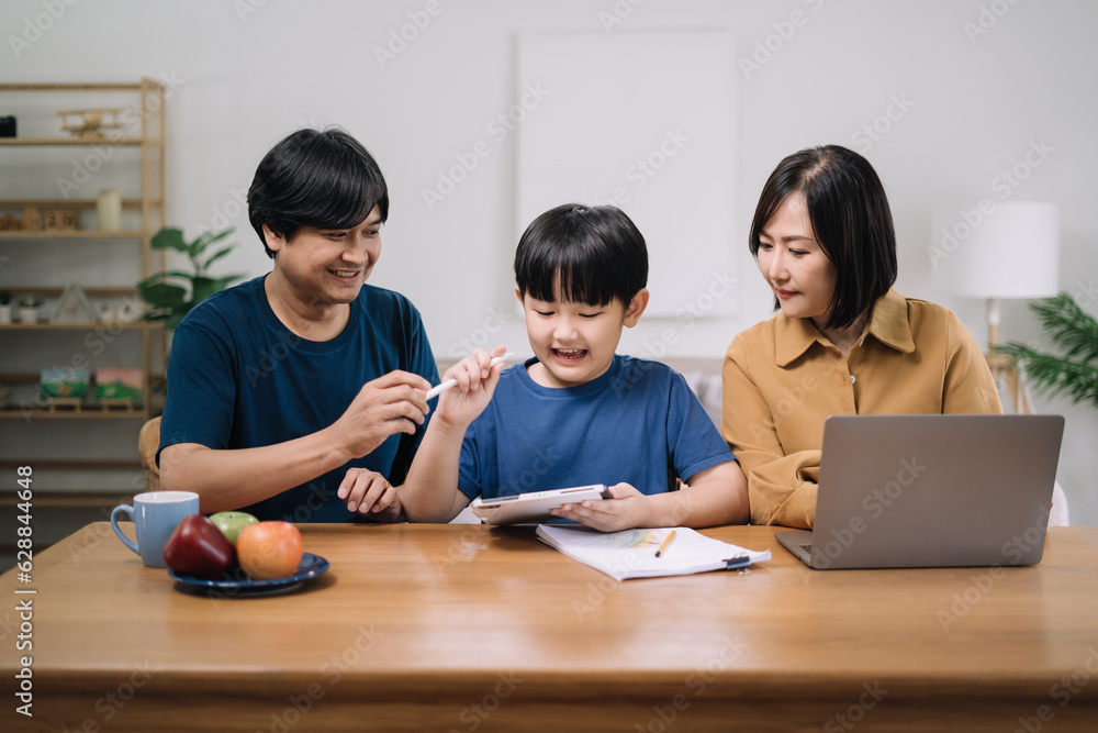 work from home education concept and family at home sitting at desk business woman working on internet in laptop child writing in notebook work from home education concept and family at home sitting at desk business woman working on internet in laptop child writing in notebook