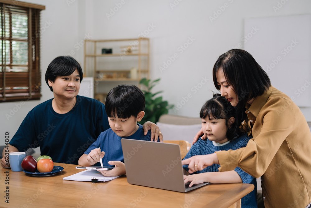 work from home education concept and family at home sitting at desk business woman working on internet in laptop child writing in notebook work from home education concept and family at home sitting at desk business woman working on internet in laptop child writing in notebook