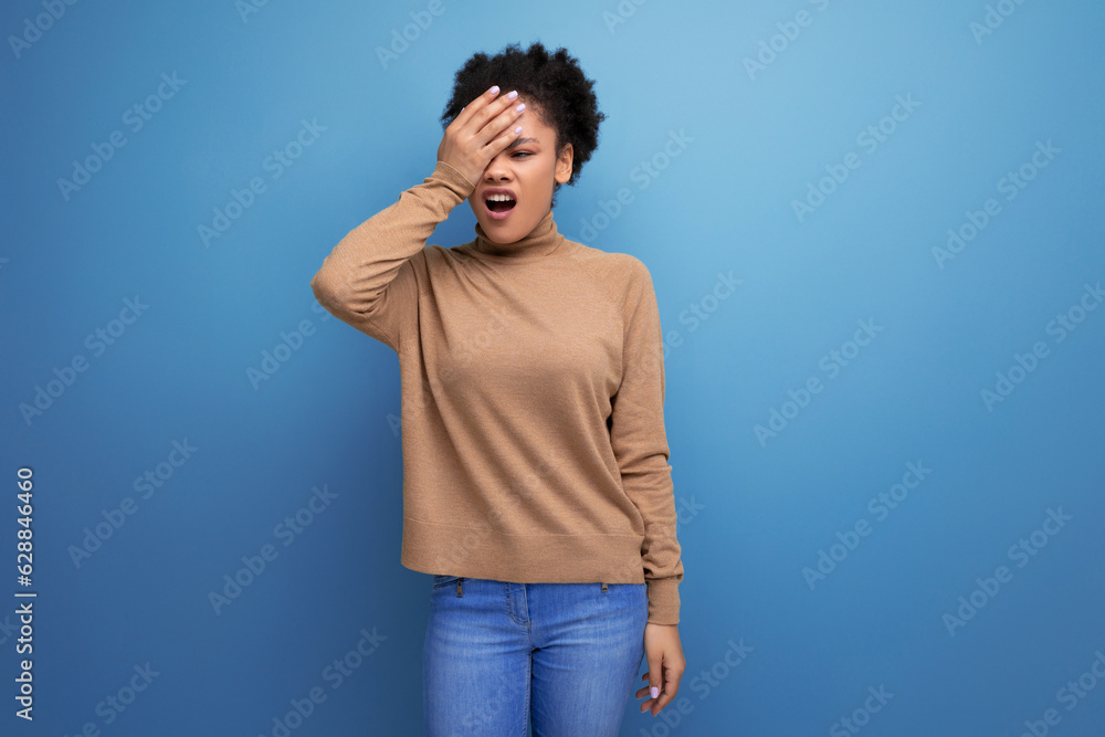 young attractive latin woman with black afro hair pulled back in ponytail isolated on background with copy space young attractive latin woman with black afro hair pulled back in ponytail isolated on background with copy space