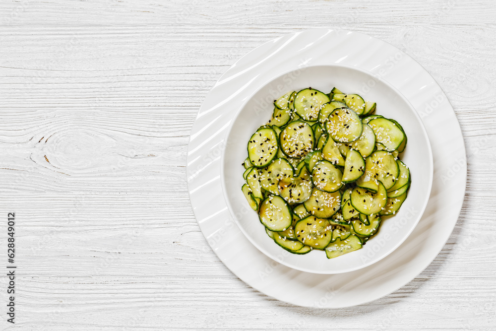 Sunomono, Japanese Cucumber Salad in a white bowl Sunomono, Japanese Cucumber Salad in a white bowl