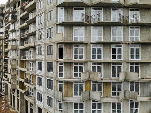 construction of a multi-storey residential building in the city. close up view. High quality photo