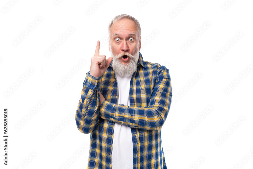 smart mature gray-haired man with a beard in a shirt has an idea on a white background smart mature gray-haired man with a beard in a shirt has an idea on a white background