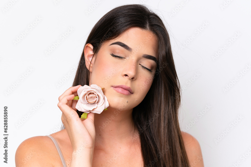Young Brazilian woman isolated on white background holding flowers. Close up portrait Young Brazilian woman isolated on white background holding flowers. Close up portrait