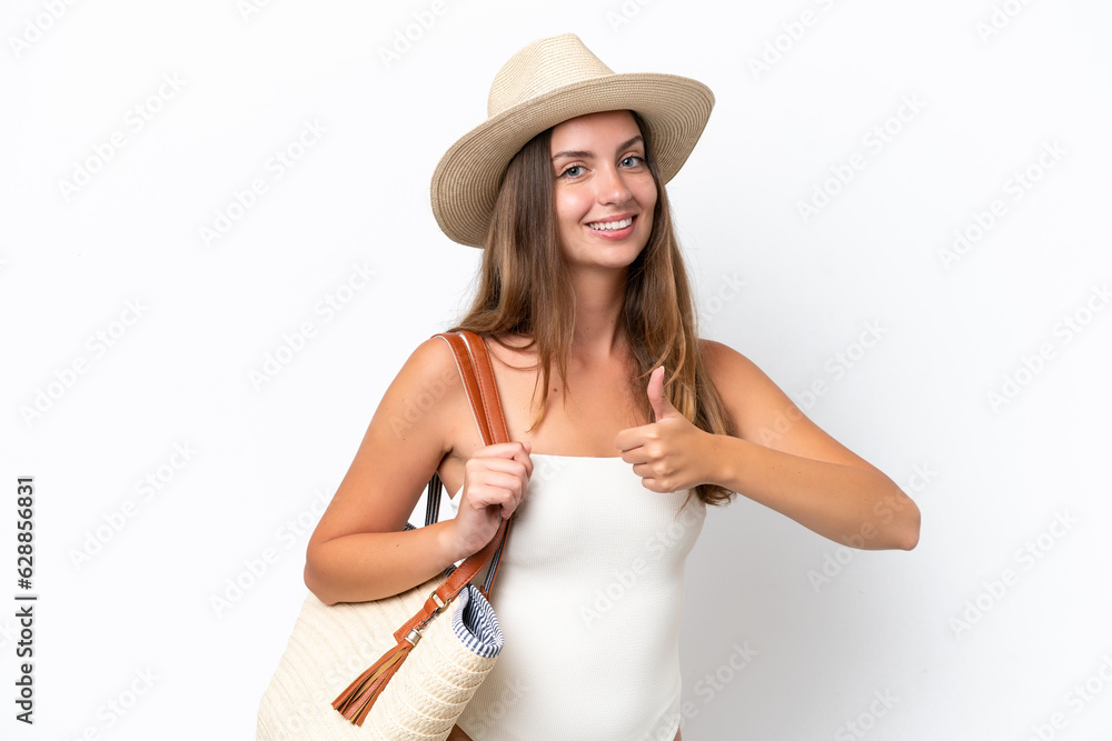 Young caucasian woman in swimsuit in summer holidays isolated on white background giving a thumbs up gesture Young caucasian woman in swimsuit in summer holidays isolated on white background giving a thumbs up gesture