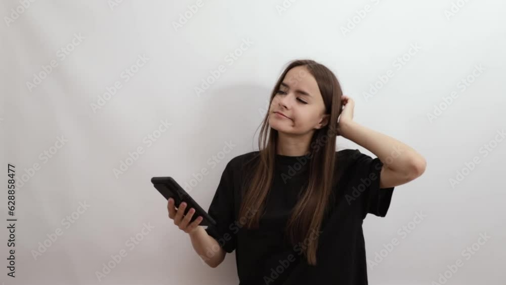 teenager with smartphone thinks which service to choose,young woman buys goods in online store,girl using phone,ordering food,online dating,chatting on mobile device,booking hotel air tickets online teenager with smartphone thinks which service to choose,young woman buys goods in online store,girl using phone,ordering food,online dating,chatting on mobile device,booking hotel air tickets online