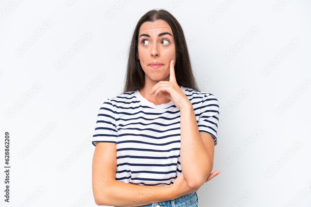 Young caucasian woman isolated on white background having doubts and thinking Young caucasian woman isolated on white background having doubts and thinking