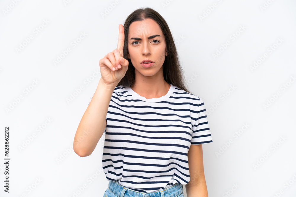 Young caucasian woman isolated on white background counting one with serious expression Young caucasian woman isolated on white background counting one with serious expression