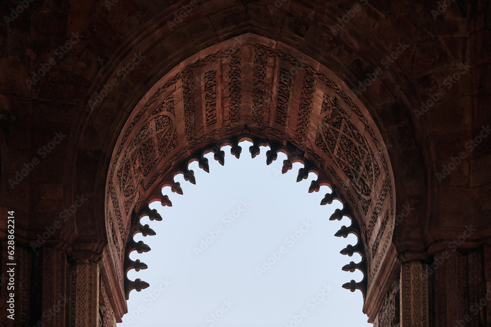 Alai Darwaza landmark part Qutb complex in South Delhi, India, Alai Darwaza main gateway decorated with red sandstone and inlaid white marble decorations, popular touristic spot in New Delhi