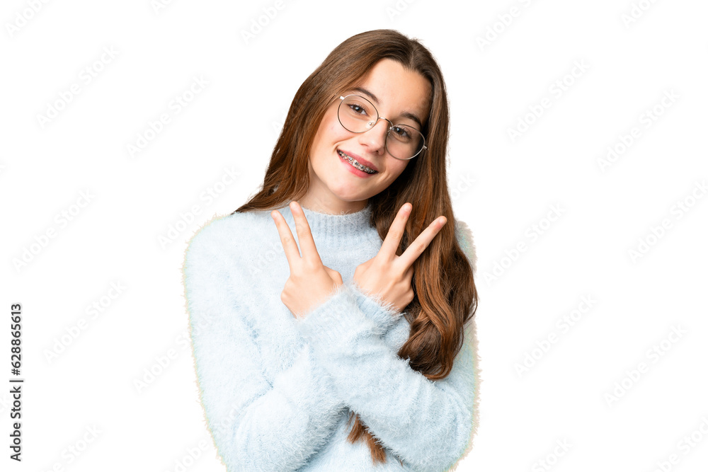 Teenager girl over isolated chroma key background smiling and showing victory sign Teenager girl over isolated chroma key background smiling and showing victory sign