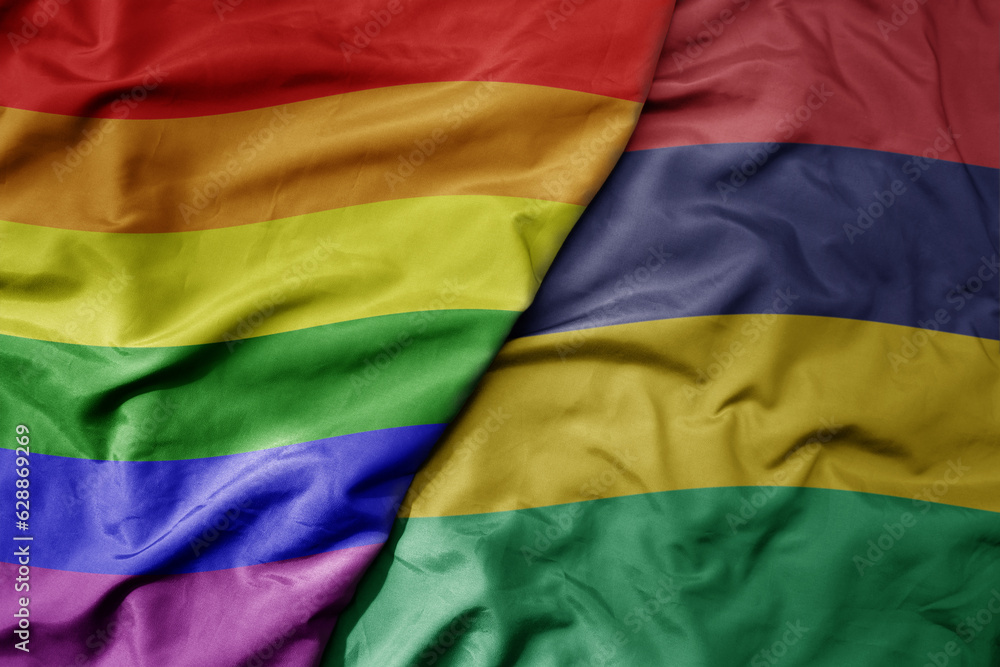 big waving realistic national colorful flag of mauritius and rainbow gay pride flag .