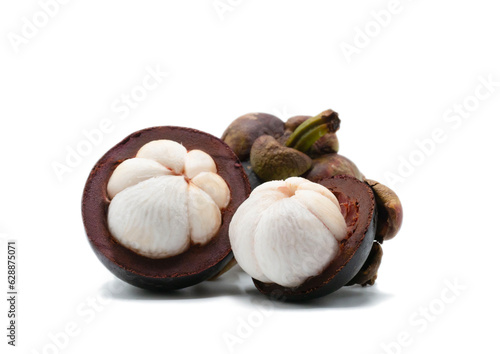 Tropical fruits. Two cut in half of mangosteen isolated on white background with clipping path.