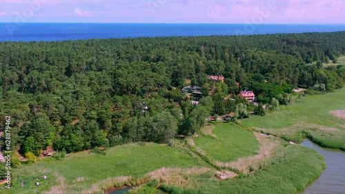 Aerial view with Ferin houses in the forest between the Vistula Spit and the Baltic Sea on the Polish Bodden coast near Kaliningrad photo