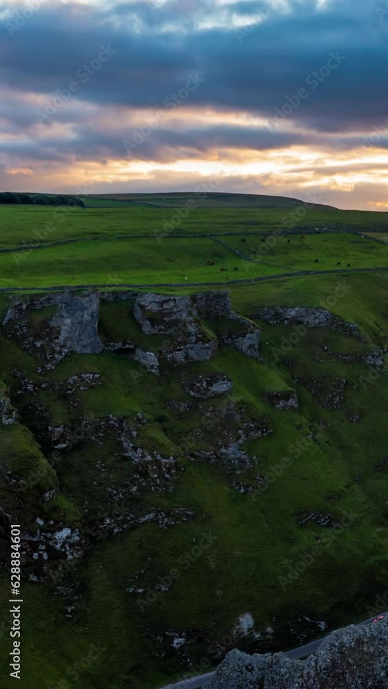 English countryside aerial timelapse with fast moving clouds over green fields and hills. Time Lapse of Brecon Beacons National Park in Wales. Aerial vertical, vertical video background. English countryside aerial timelapse with fast moving clouds over green fields and hills. Time Lapse of Brecon Beacons National Park in Wales. Aerial vertical, vertical video background.