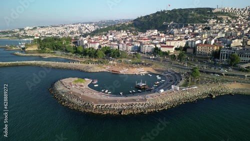 Aerial video of buildings on mountains on the sea shore in Trabzon city, Turkey photo