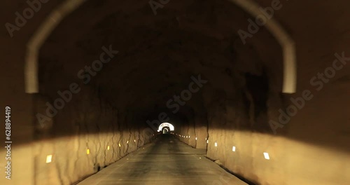 View from car of driving car in a tunnel, in Sichuan province, China photo