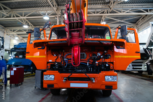 Trucks repair in car service. © scharfsinn86