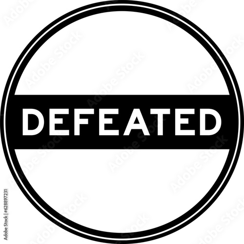 Black color round seal sticker in word defeated on white background