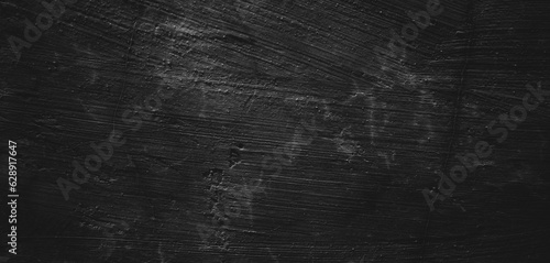 Black background of natural paintbrush stroke textured cement or stone old.Horror Cement Texture. Grunge scary background. Wall Concrete Old black