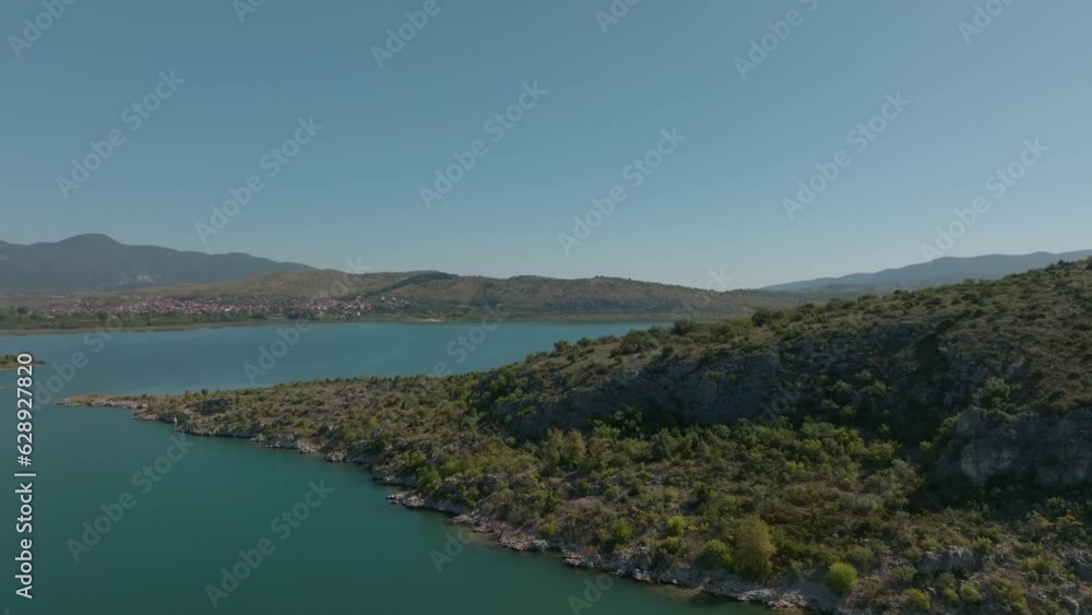 Aerial video of the sea and the mountains covered with trees on the shore Aerial video of the sea and the mountains covered with trees on the shore