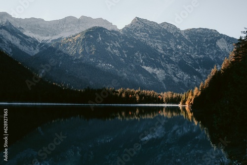 there is a lake with the mountains in the background it appears to be in the