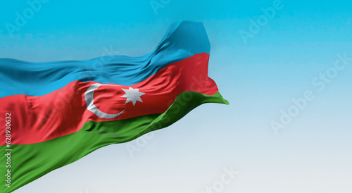 The national flag of Azerbaijan waving in the wind photo