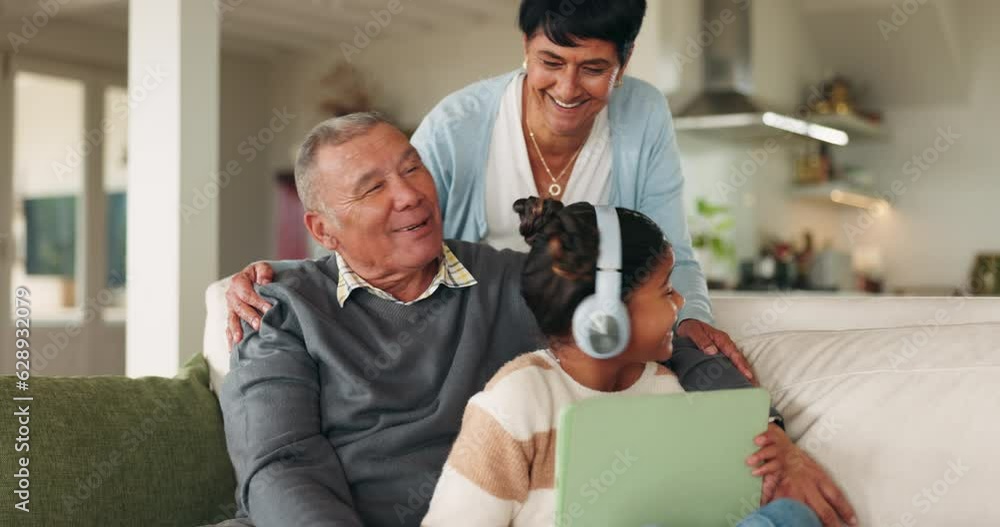 Tablet, grandparents and kid with headphones in home for music, bonding and happy family together on sofa. Girl, grandmother and grandfather with tech for internet, social media or app for learning Tablet, grandparents and kid with headphones in home for music, bonding and happy family together on sofa. Girl, grandmother and grandfather with tech for internet, social media or app for learning