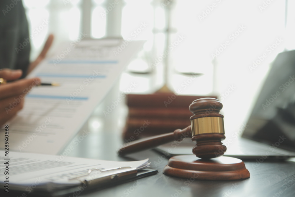 Judge gavel with Justice lawyers having team meeting at law firm background. Concepts of Law and Legal services. Judge gavel with Justice lawyers having team meeting at law firm background. Concepts of Law and Legal services.