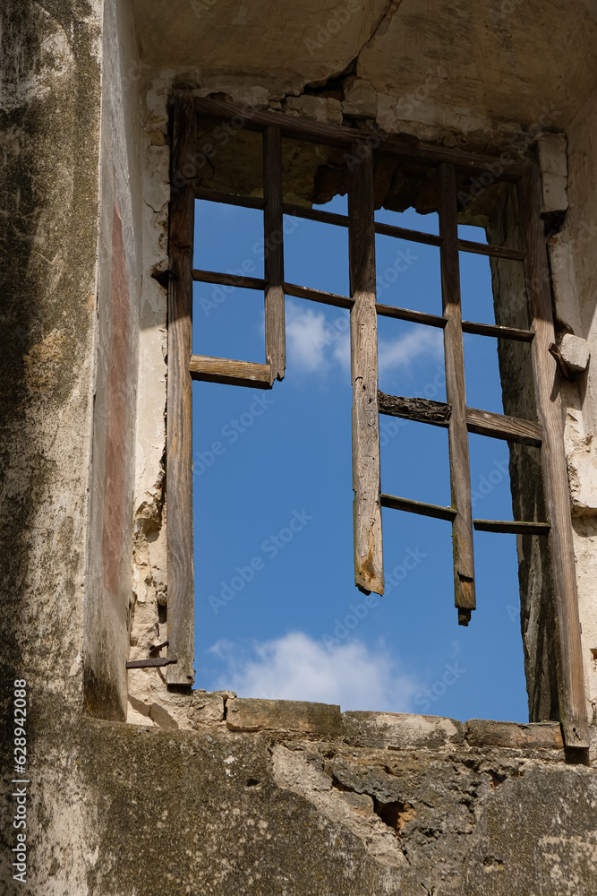 Broken wooden window frame in an old house. Old houses concept. Unexpected angle. Copy space. Broken wooden window frame in an old house. Old houses concept. Unexpected angle. Copy space.