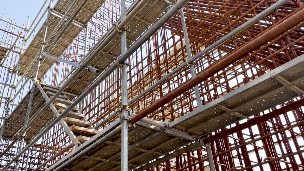 high-rise scaffolding around the reinforcing cage of a reinforced concrete structure