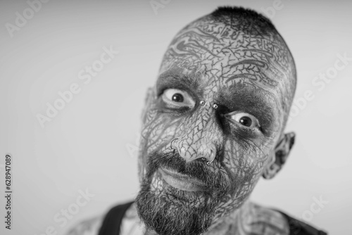Εκτύπωση καμβά Young tattooed male posing against a white background