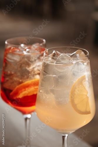 Closeup shot of crystal clear glasses filled with a refreshing alcoholic beverage and icecubes