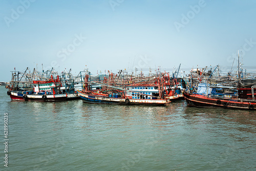 Fishing boat is out fishing. Fishermen is a career that has been popular in seaside city of Thailand. many fishing boats in the seaport