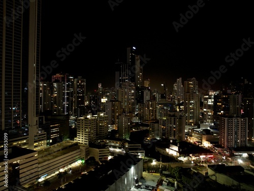 Vibrant cityscape of Panama City illuminated by the night lights.