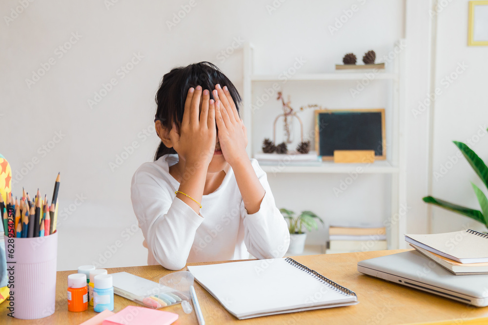 young Asian female college student preparing for the exam. Depressed young woman student. young Asian female college student preparing for the exam. Depressed young woman student.