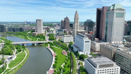 Aerial video downtown Columbus Ohio slow tilt into city from beside river photo