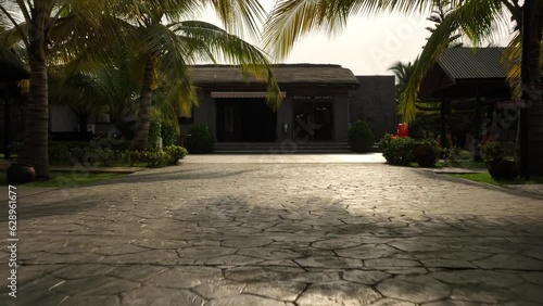 Buildings and tropical palm trees in Accra, Ghana photo