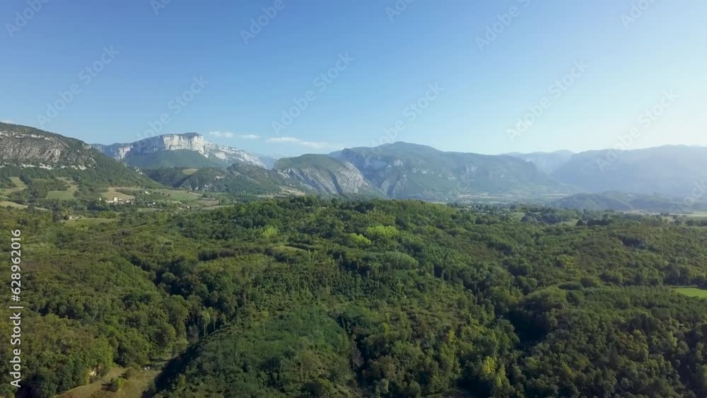 Drone view over forested mountains during a sunny day Drone view over forested mountains during a sunny day