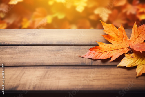 wooden table with orange leaves autumn background. High quality photo
