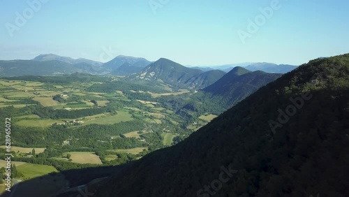 Drone view over wild green landscapes on a sunny day