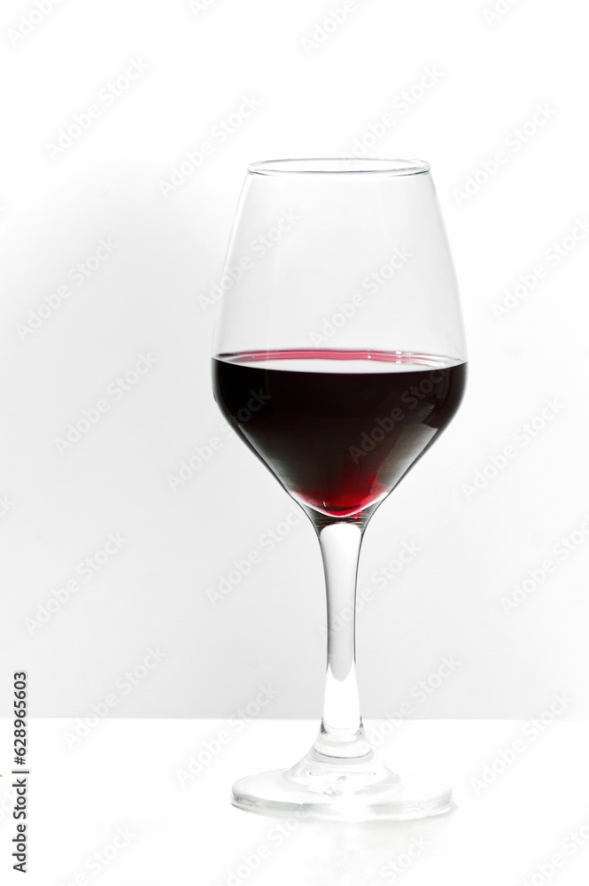 Glass of red wine on a white background Glass of red wine on a white background