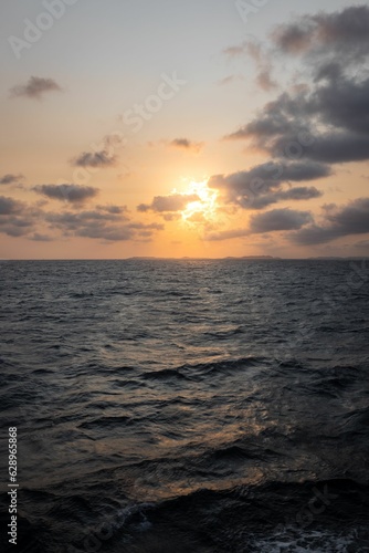 sunset sun on the horizon over the sea