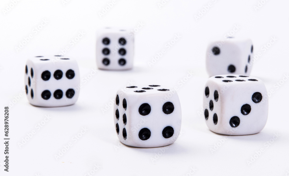 White game dice on a white background. Selective focus. White game dice on a white background. Selective focus.
