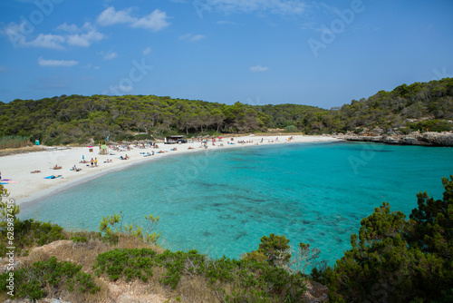 Beautiful sunset beach landscape  exotic tropical island nature  blue sea water  ocean waves  colorful red yellow sky  summer holidays vacation in Mallorca  Spain