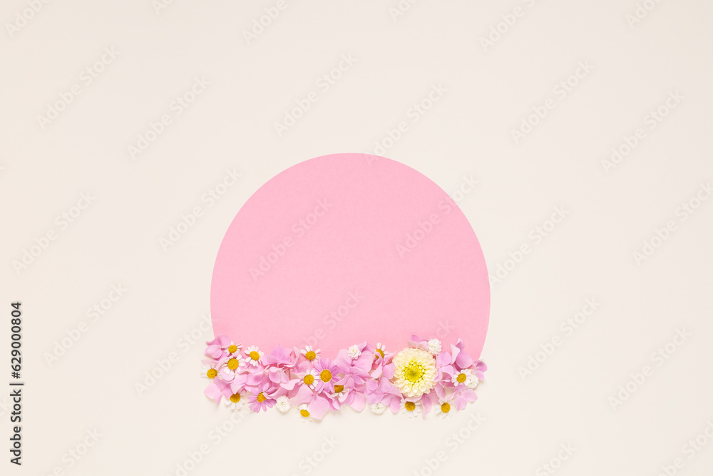 Creative layout made with flowers and paper tape for text on bright beige background. Flat lay. Spring minimal concept. Holiday mock up greeting card. Easter, spring, summer concept. Creative layout made with flowers and paper tape for text on bright beige background. Flat lay. Spring minimal concept. Holiday mock up greeting card. Easter, spring, summer concept.