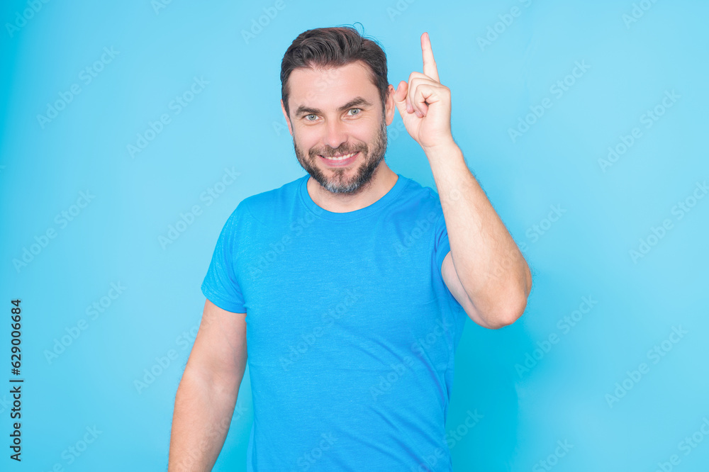 Happy man thinking of idea on studio background. Portrait of man has many ideas. Man with index fingers hand gesture man has idea, presenting promo offer. Decision idea process. Good idea. Happy man thinking of idea on studio background. Portrait of man has many ideas. Man with index fingers hand gesture man has idea, presenting promo offer. Decision idea process. Good idea.
