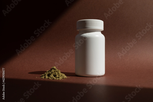 Hemp Protein Powder And White Bottle On Brown Background. Organic Green Super Food, Healthy Lifestyle. Nutritional Supplement, Plant-based Protein. Horizontal Plane, Copy Space For Text. Hard Shadow photo