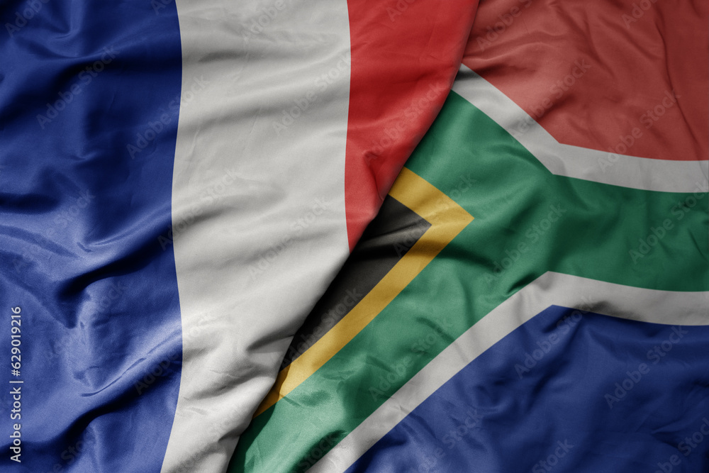 big waving realistic national colorful flag of france and national flag of south africa .