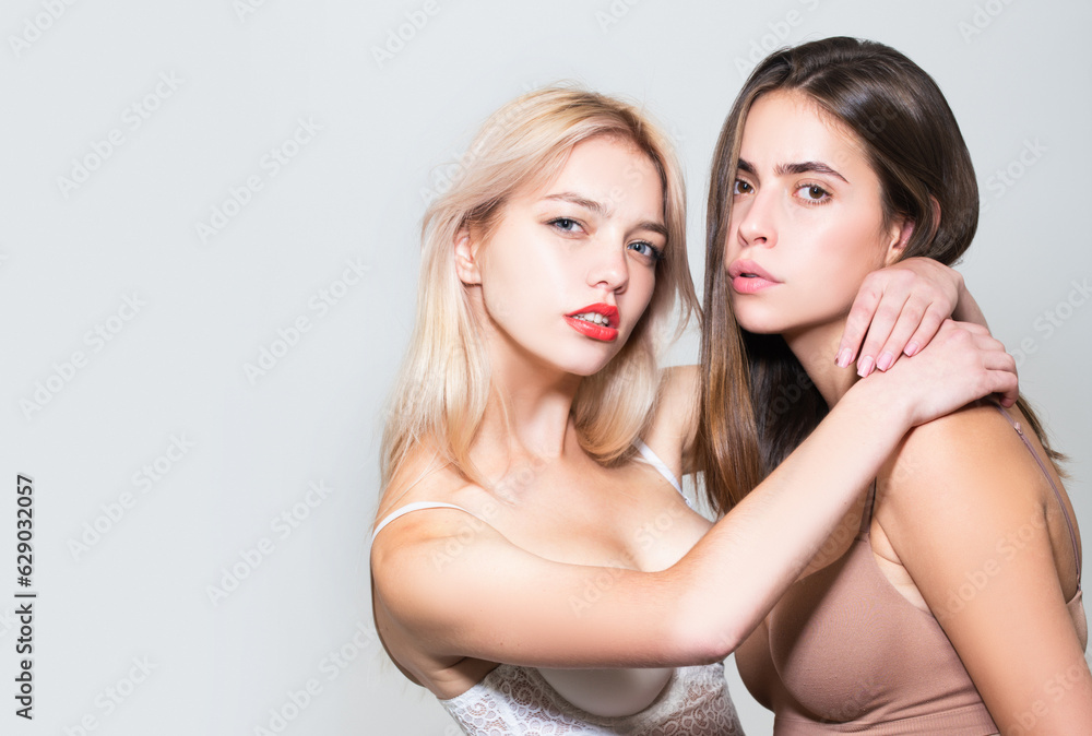 Girlfriends hugging. Girls embracing. Tenderness young woman. Lesbian foreplay. Two sexy girlfriends. Two sexy girls. Sensual lesbians couple. Young sexy female lovers posing sensuality. Girlfriends hugging. Girls embracing. Tenderness young woman. Lesbian foreplay. Two sexy girlfriends. Two sexy girls. Sensual lesbians couple. Young sexy female lovers posing sensuality.